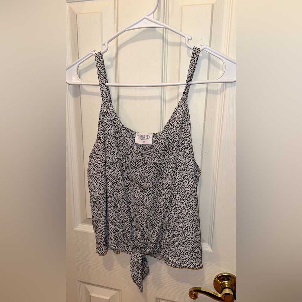Black and white Sienna Sky knotted tank with faux buttons. Size Medium.